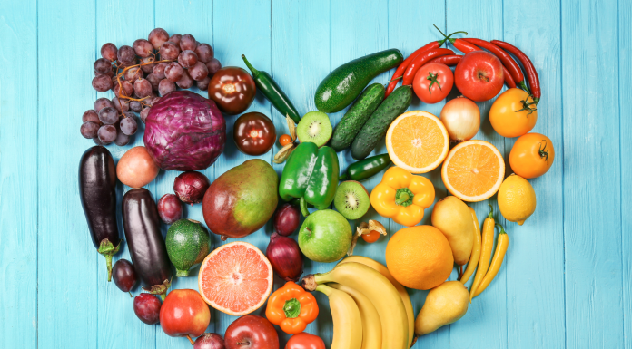 Fruits and vegetables organized by color in shape of a heart