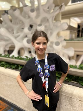 middle school girl smiling at camera with medals...middle school graduation celebration