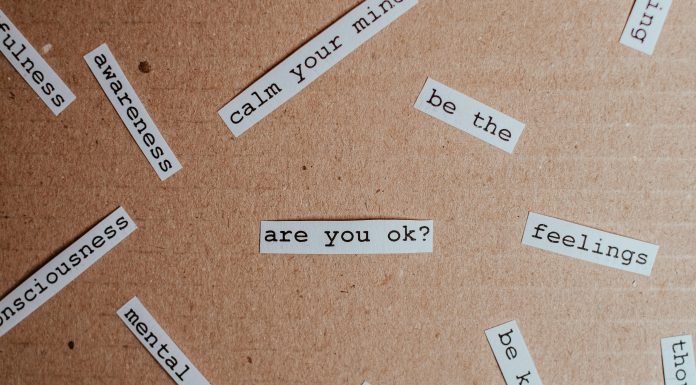 a bunch of papers saying things like mental health, peace, are you ok, be kind mental health support