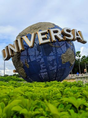 The Universal Studios Globe with word Universal over top of it taken by darshan patel via unsplash