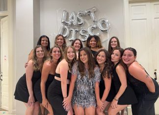 12 women smiling at the camera celebrating Gen Z bachelorette weekend