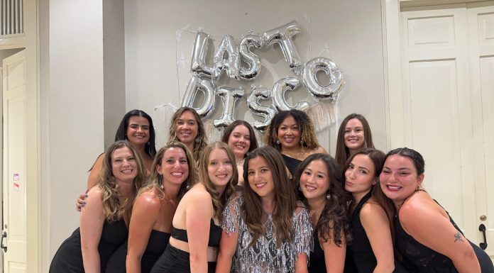 12 women smiling at the camera celebrating Gen Z bachelorette weekend