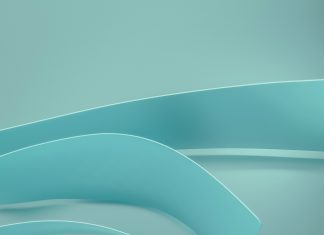 teal ribbons for PCOS awareness month on a light teal background