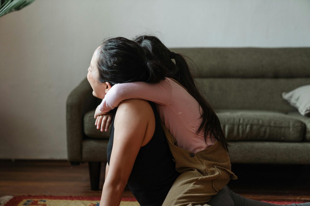 child on top of mom as she's trying to workout, mom burnout