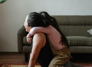 child on top of mom as she's trying to workout, mom burnout