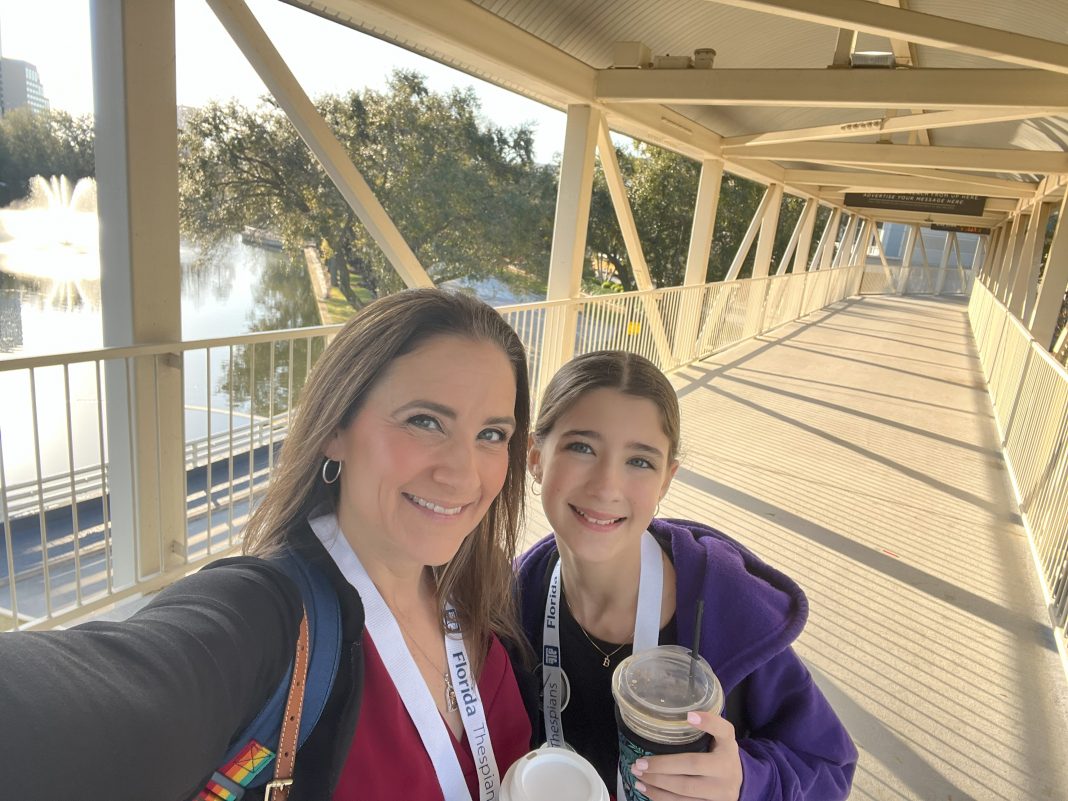 mom and daughter smiling at the camera, motherhood and social media pressure