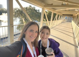 mom and daughter smiling at the camera, motherhood and social media pressure