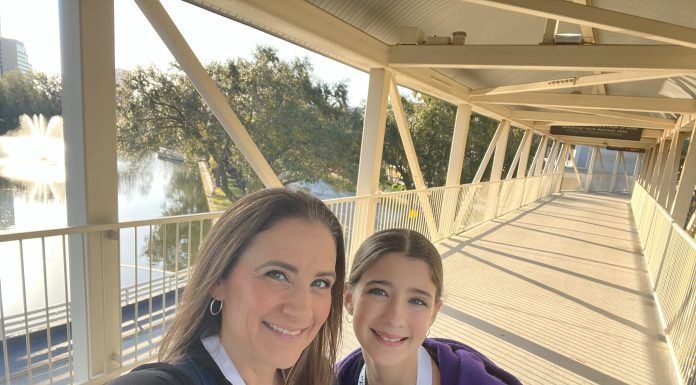 mom and daughter smiling at the camera, motherhood and social media pressure