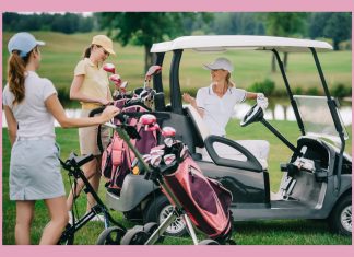 three women talking t each other while a golf retreat with golf clubs and golf cart