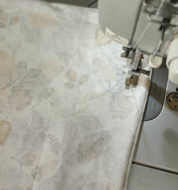 sewing machine sewing inside out of fall fabric