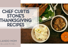 Chef Curtis Stone’s Thanksgiving Recipes Megan Watson via Unsplash turkey, mashed potatoes, stuffing and rolls in white dishes and a small pumpkin from above all on a brown table with 'Chef Curtis Stone's Thanksgiving Recipes' on the left