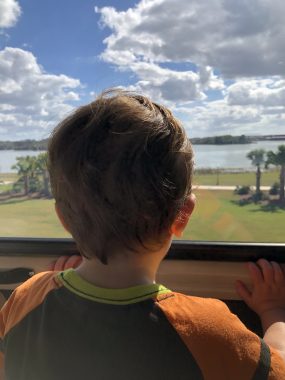 young boy looking at disney world after his first haircut at disney world