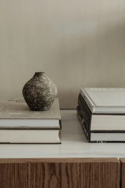 karolina-grabowska via unsplash vase on top of a stack of books with another beside it