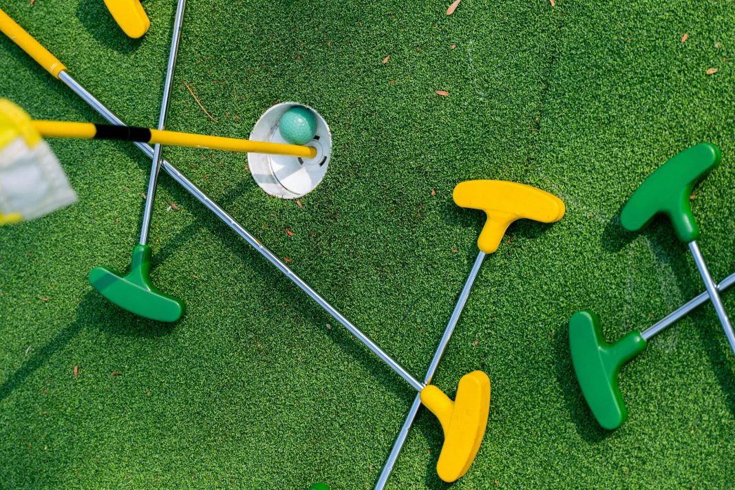 mini golf clubs on the green for disney activities in orlando