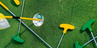 mini golf clubs on the green for disney activities in orlando