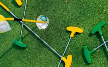 mini golf clubs on the green for disney activities in orlando