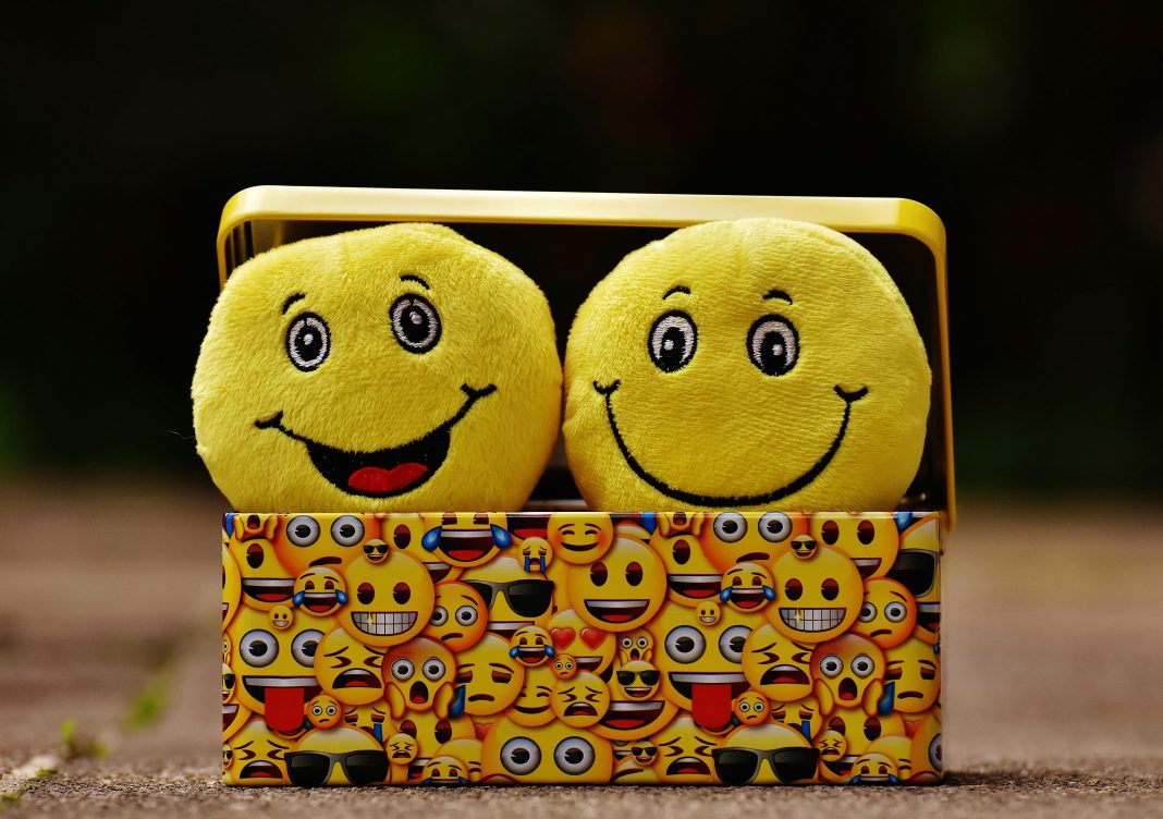 pexels-pixabay-207983 box of emojis with two plushie emoji for emoji slang