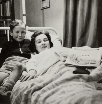 woman, mom, lying in bed with her son next to her. older photo, Balancing Motherhood and Recovery