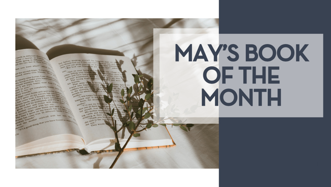 may's book club book Kate tell via unsplash image of an open book on white fabric with branch over top of book with words 'may's book of the month' on the side