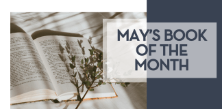 Kate tell via unsplash image of an open book on white fabric with branch over top of book with words 'may's book of the month' on the side