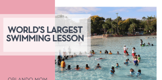 Children and instructors form a circle in the shallow lagoon during the world’s largest swimming lesson at Disney’s Typhoon Lagoon
