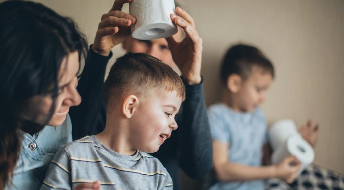 Pelvic Health: Back-to-School Edition Mother and children sitting together at a table, smiling and talking, highlighting family routines and public health awareness.