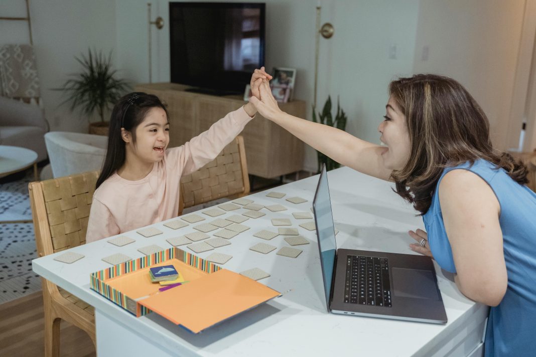mother and daughter at table for back-to-school with adhd, body doubling