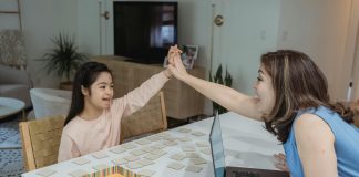 mother and daughter at table for back-to-school with adhd, body doubling