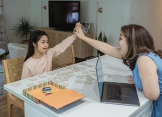 Back-to-School with ADHD: Make This Transition Less Stressful mother and daughter at table for back-to-school with adhd, body doubling