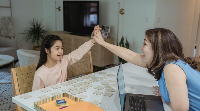 Back-to-School with ADHD: Make This Transition Less Stressful mother and daughter at table for back-to-school with adhd, body doubling