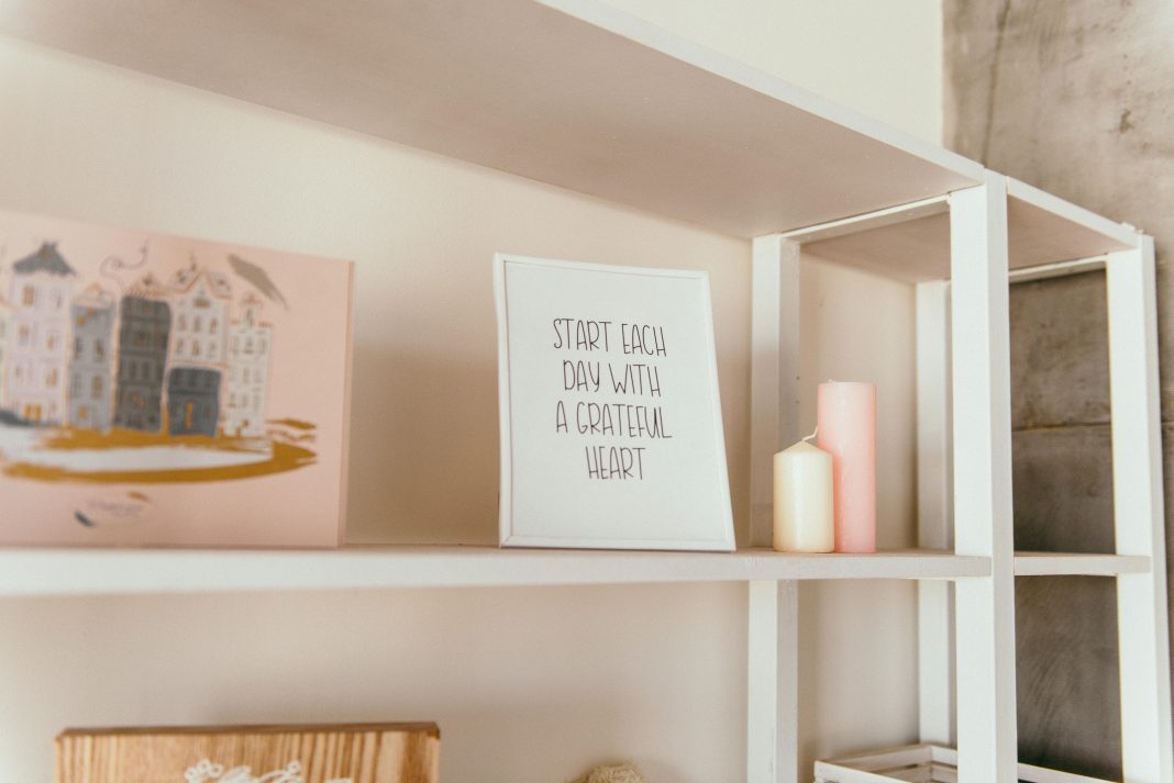 Letter board on a crowded wooden shelf surrounded by scattered supplies, perfectly capturing back-to-school chaos