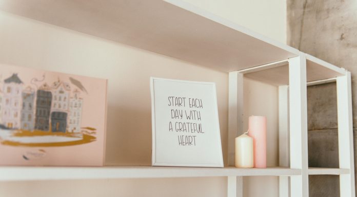 Back-to-School Chaos? Here’s How to Calm the Visual Noise at Home Letter board on a crowded wooden shelf surrounded by scattered supplies, perfectly capturing back-to-school chaos