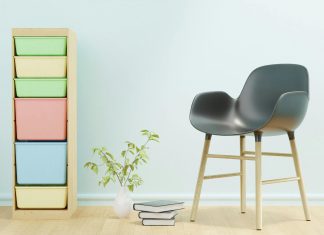 Organization Hacks for Moms with ADHD Minimalist home office setup with a black and brown chair beside a white wall, offering distraction-free space ideal for moms with ADHD.