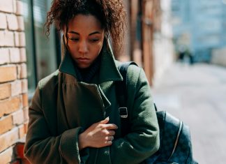 How to Manage Seasonal Depression as a Florida Mom woman wrapped up in a coat looking sad, seasonal depression