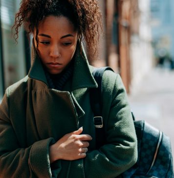 How to Manage Seasonal Depression as a Florida Mom woman wrapped up in a coat looking sad, seasonal depression