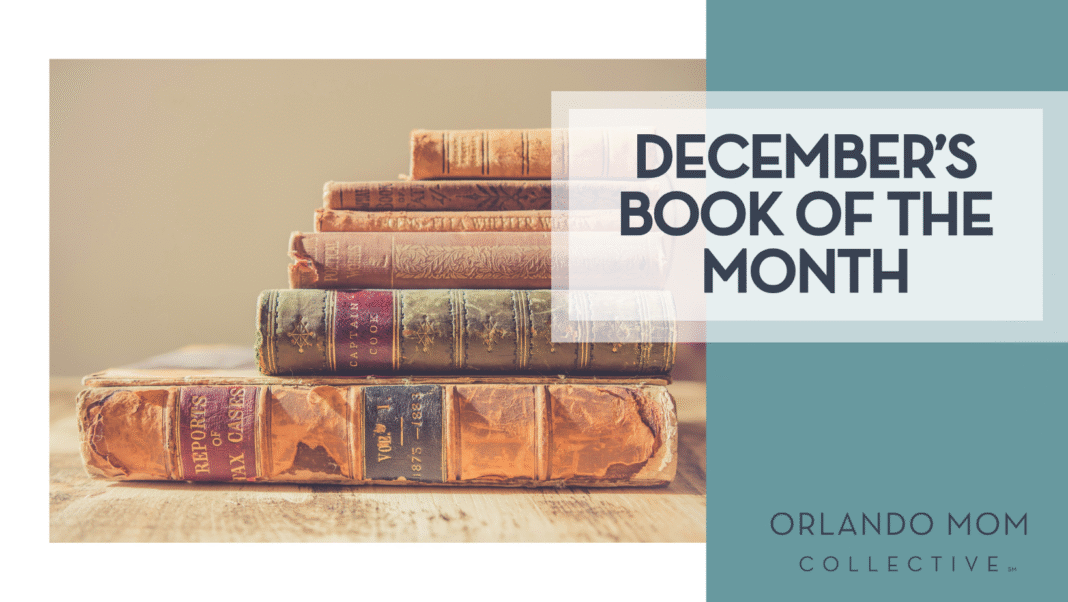 December’s book of the month Chris Lawton via Unsplash old books stacked on wood table with tan background and 'December's book of the month' on the right hand side.