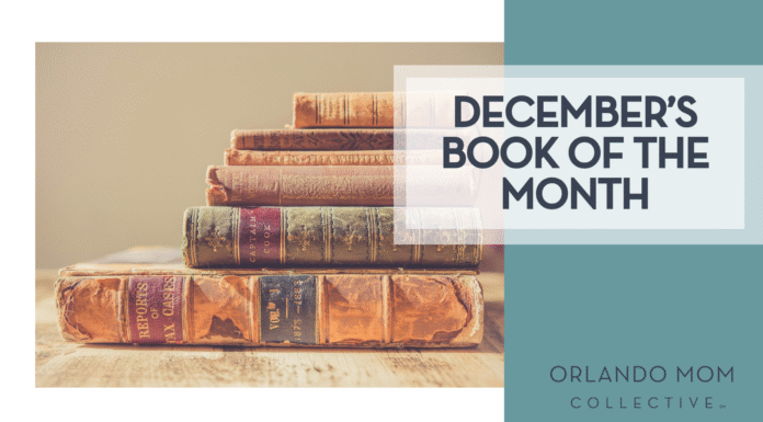 Chris Lawton via Unsplash old books stacked on wood table with tan background and 'December's book of the month' on the right hand side.